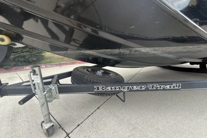 Slide: The Image of 2021 Ranger RT178 boat on Ranger Trail trailer, parked on concrete surface. - 27