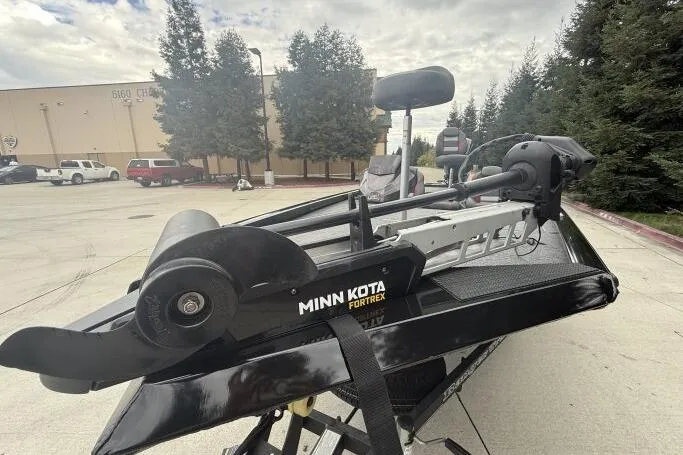 Slide: The Image of 2021 Ranger RT178 boat with Minn Kota Fortrex trolling motor in a parking lot. - 4