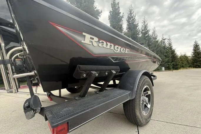 Slide: The Image of 2021 Ranger RT178 boat on trailer, black exterior, parked outdoors. - 8
