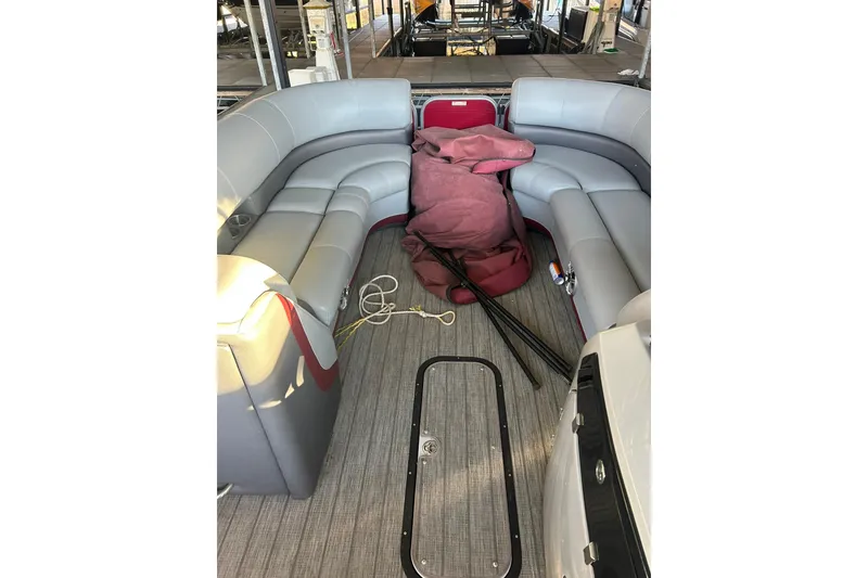 Slide: The Image of 2020 Manitou 25 Oasis SR SHP pontoon boat with spacious gray seating. - 13