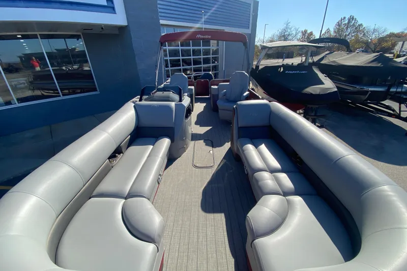 Slide: The Image of 2020 Manitou 25 Oasis SR SHP pontoon boat with spacious seating and modern design. - 14
