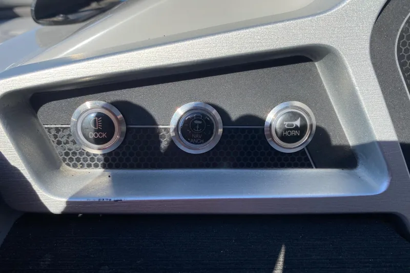 Slide: The Image of Control panel of 2020 Manitou 25 Oasis SR SHP with dock, nav/anchor, and horn buttons. - 25