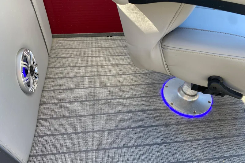 Slide: The Image of 2020 Manitou 25 Oasis SR SHP boat interior with speaker and illuminated seat base. - 28