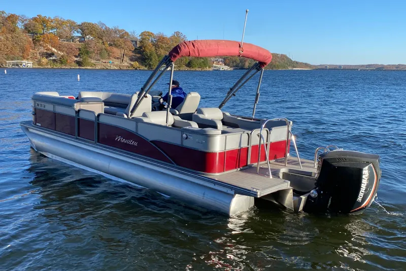 Slide: The Image of 2020 Manitou 25 Oasis SR SHP pontoon boat on a scenic lake. - 3
