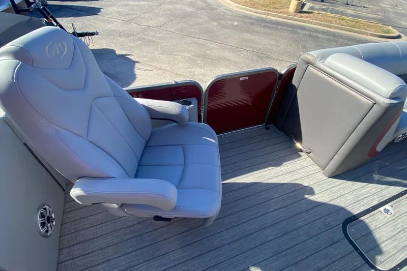 Slide: The Image of 2020 Manitou 25 Oasis SR SHP boat interior with gray seating and flooring. - 30
