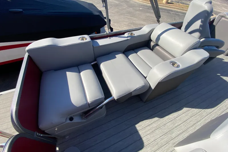 Slide: The Image of 2020 Manitou 25 Oasis SR SHP boat with luxurious gray seating and cup holders. - 36