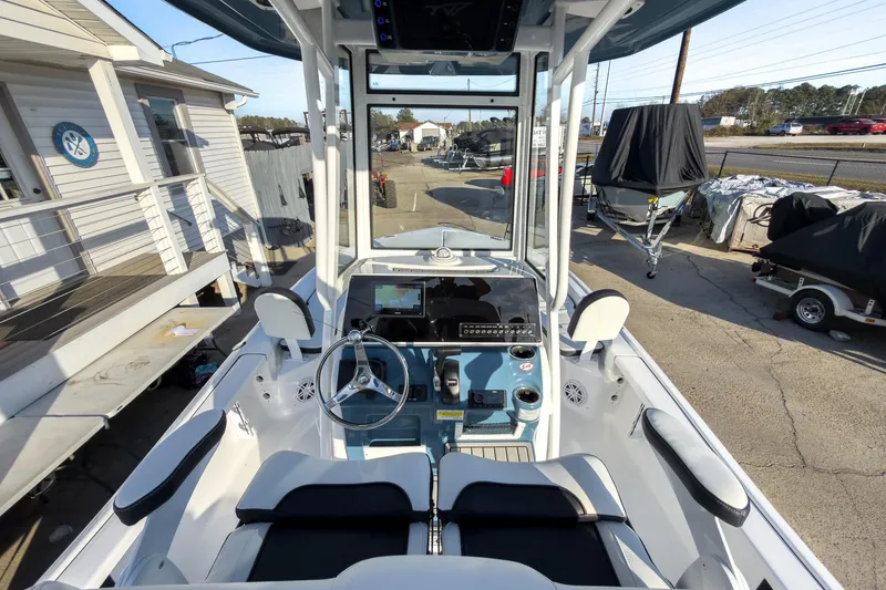 Slide: The Image of 2026 Tidewater 2210 Carolina Bay boat interior with modern dashboard and steering wheel. - 12