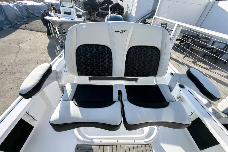 Slide: The Image of 2026 Tidewater 2210 Carolina Bay boat seating with black and white upholstery. - 21