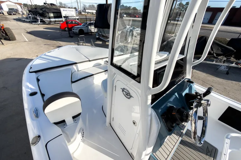 Slide: The Image of 2026 Tidewater 2210 Carolina Bay boat interior with steering console and seating. - 27