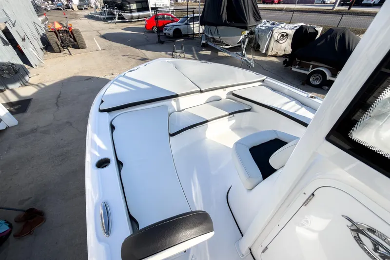 Slide: The Image of 2026 Tidewater 2210 Carolina Bay boat interior with white seating and modern design. - 30