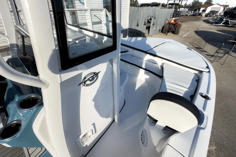Slide: The Image of 2026 Tidewater 2210 Carolina Bay boat interior with seating and console details. - 31
