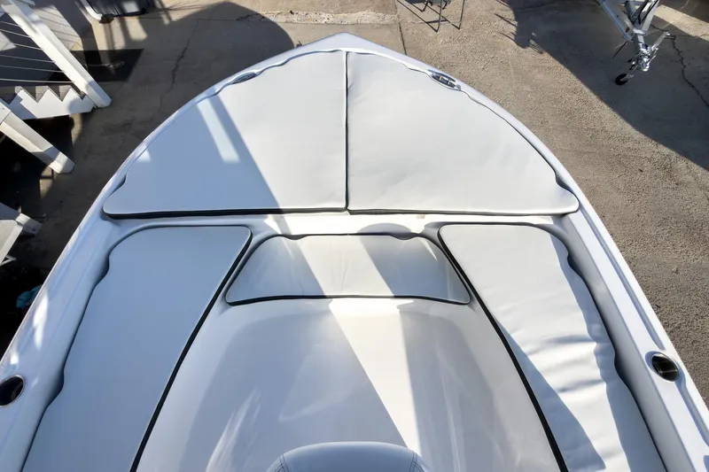 Slide: The Image of 2026 Tidewater 2210 Carolina Bay boat with cushioned bow seating. - 32