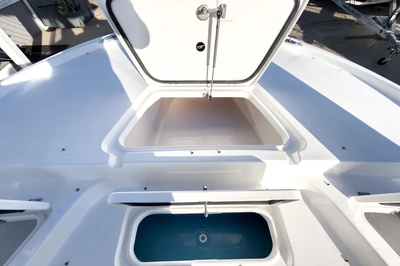 Slide: The Image of 2026 Tidewater 2210 Carolina Bay boat storage compartments, open and spacious design. - 34