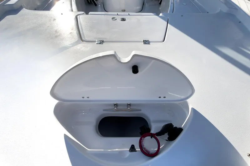 Slide: The Image of 2026 Tidewater 2210 Carolina Bay boat storage compartment open on deck. - 37