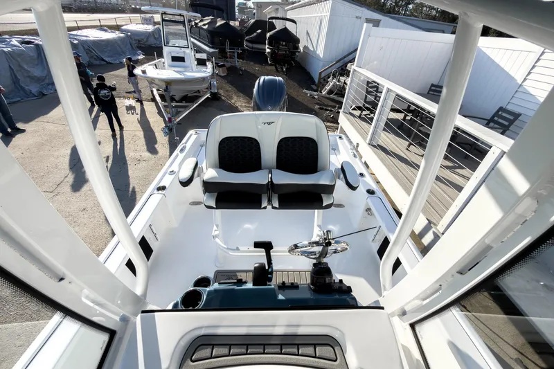 Slide: The Image of 2026 Tidewater 2210 Carolina Bay boat interior with dual seats and steering wheel. - 43