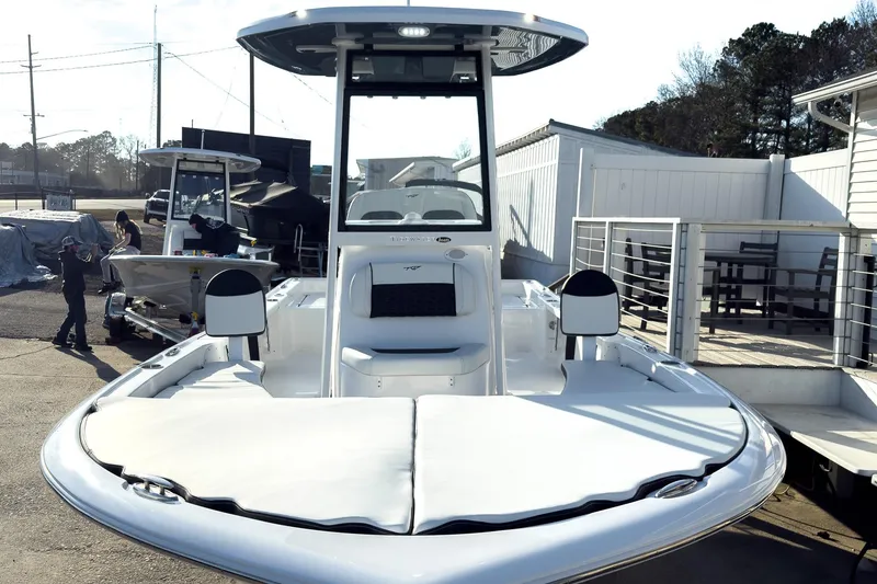 Slide: The Image of 2026 Tidewater 2210 Carolina Bay boat displayed at a marina, showcasing sleek design. - 5