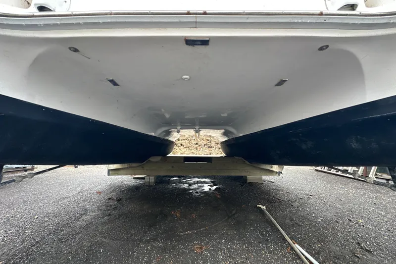 Slide: The Image of 2014 Gemini Legacy 35 catamaran on land, showcasing rear view and deck structure. - 10