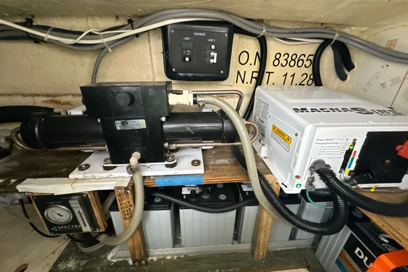 Slide: The Image of 2014 Gemini Legacy 35 sailboat cockpit with white seating and steering wheel. - 14