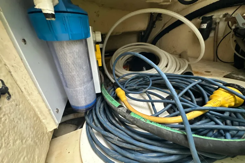 Slide: The Image of Engine room of 2014 Gemini Legacy 35 with electrical components and wiring. - 15