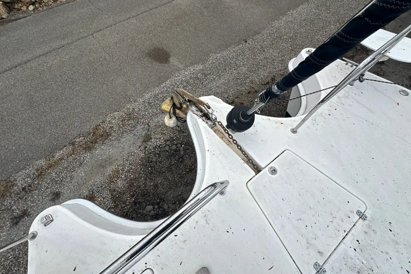 Slide: The Image of 2014 Gemini Legacy 35 sailboat deck with mast, docked under cloudy skies. - 20