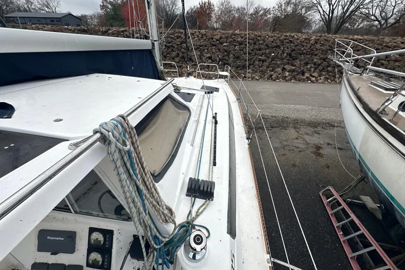 Slide: The Image of 2014 Gemini Legacy 35 sailboat on land, surrounded by other boats. - 23