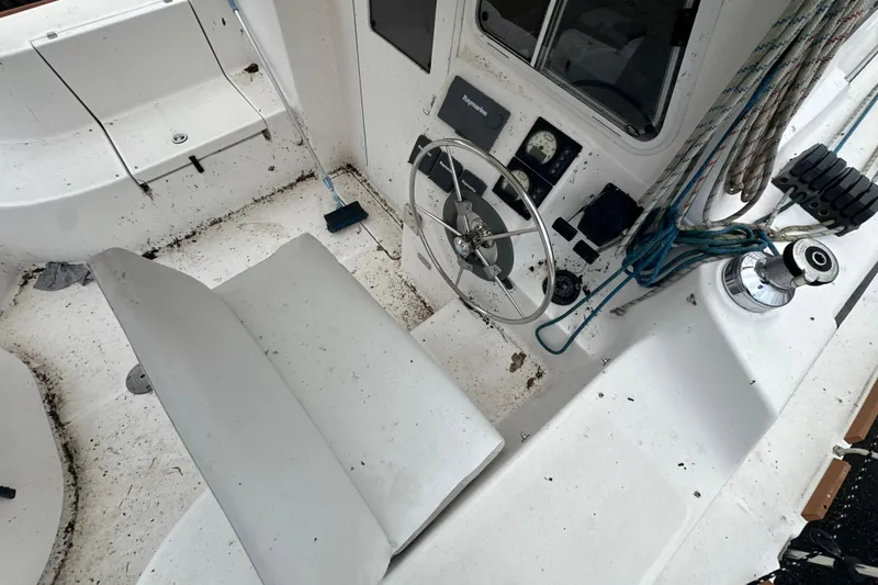 Slide: The Image of Sailboat mast of 2014 Gemini Legacy 35 against cloudy sky, with trees and rocks in background. - 25