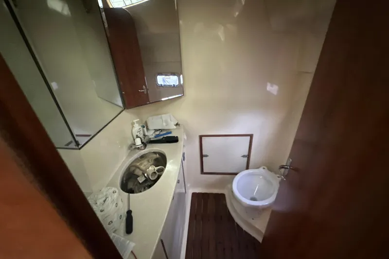 Slide: The Image of Control panel of a 2014 Gemini Legacy 35 boat interior, featuring gauges and equipment. - 29