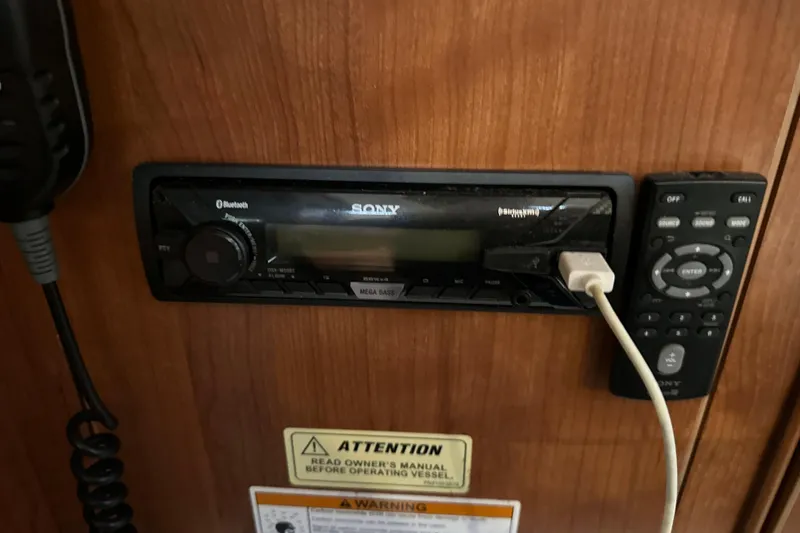 Slide: The Image of Control panel of a 2014 Gemini Legacy 35 boat with gauges and comfort control center. - 32