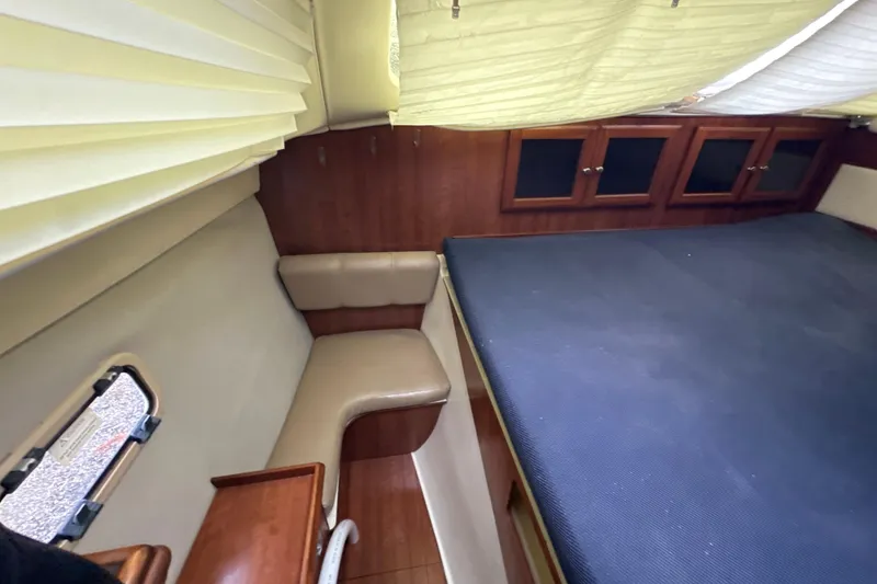 Slide: The Image of Cozy cabin interior of 2014 Gemini Legacy 35 sailboat with wooden finish and large bed. - 35