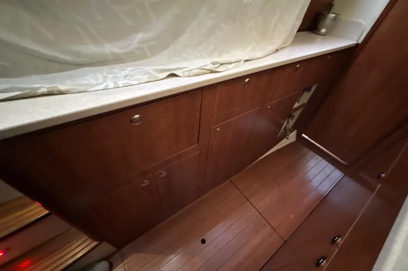 Slide: The Image of Compact kitchen area in a 2014 Gemini Legacy 35 boat, featuring a sink and stove. - 43