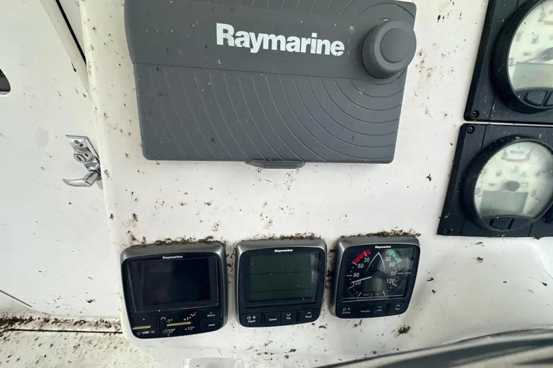 Slide: The Image of Control panel of 2014 Gemini Legacy 35 sailboat with Yanmar gauges and throttle levers. - 46