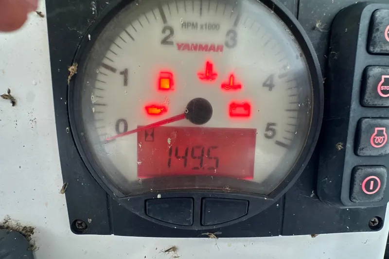 Slide: The Image of Close-up of Gemini Legacy 35 (2014) engine gauges with warning lights illuminated. - 49