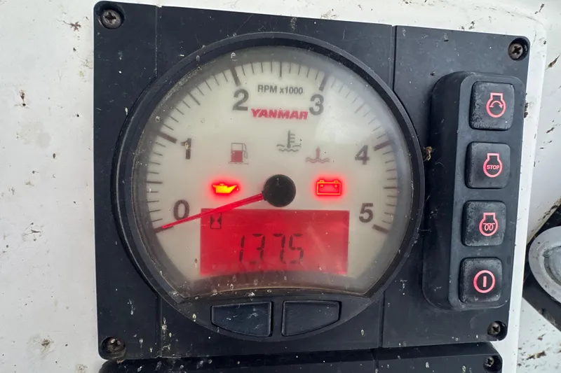 Slide: The Image of Close-up of a Yanmar engine gauge displaying 1495 hours on a 2014 Gemini Legacy 35. - 50