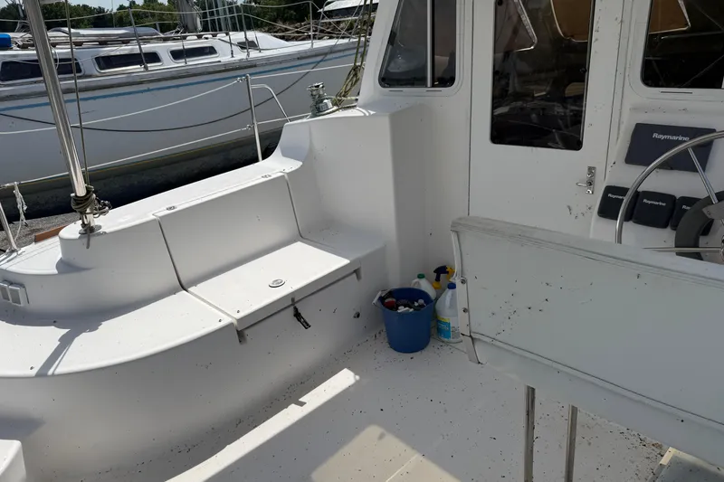 Slide: The Image of Cockpit of 2014 Gemini Legacy 35 sailboat with seating and steering wheel. - 8