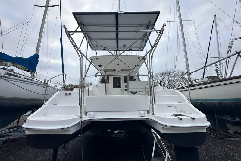 Slide: The Image of 2014 Gemini Legacy 35 sailboat, side view with branding and rigging details. - 9