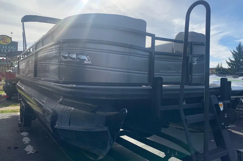 Slide: The Image of 2024 Regency 250 DL3 pontoon boat in a parking lot, partially shaded. - 3