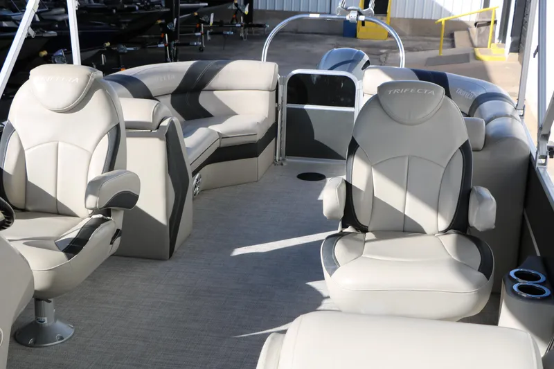 Slide: The Image of 2023 Sylvan Mirage X X3 Party Fish pontoon boat interior with plush seating. - 16