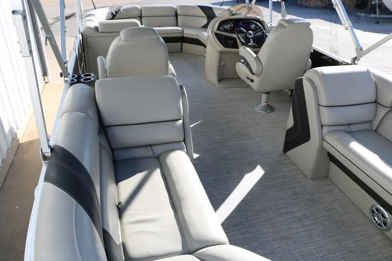 Slide: The Image of 2023 Sylvan Mirage X X3 Party Fish boat interior with plush seating and modern helm. - 17