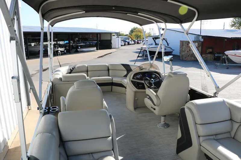 Slide: The Image of 2023 Sylvan Mirage X X3 Party Fish pontoon boat interior with seating and helm. - 18