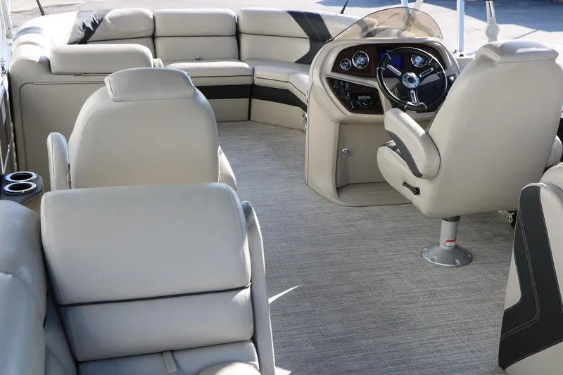 Slide: The Image of 2023 Sylvan Mirage X X3 Party Fish interior with plush seating and modern helm. - 19