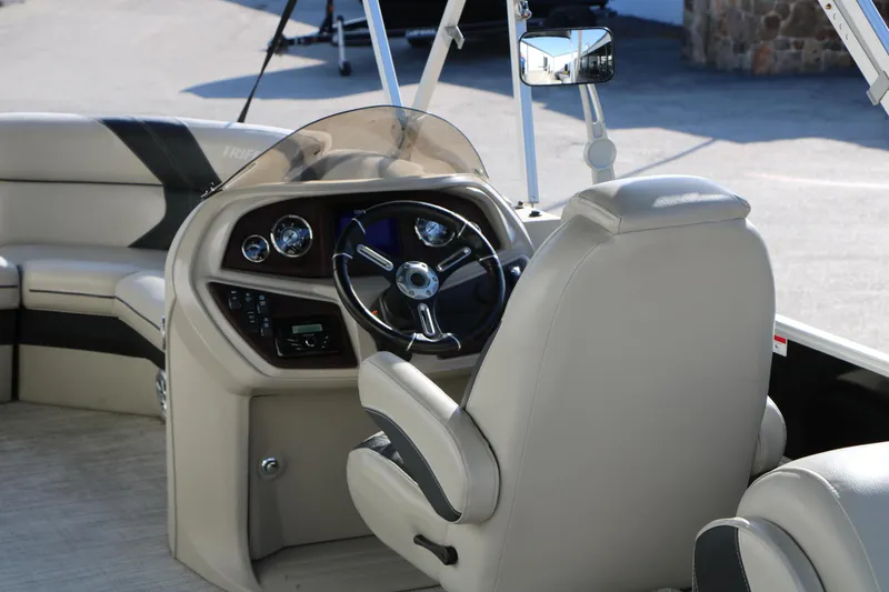 Slide: The Image of 2023 Sylvan Mirage X X3 Party Fish boat interior with steering console and seating. - 20