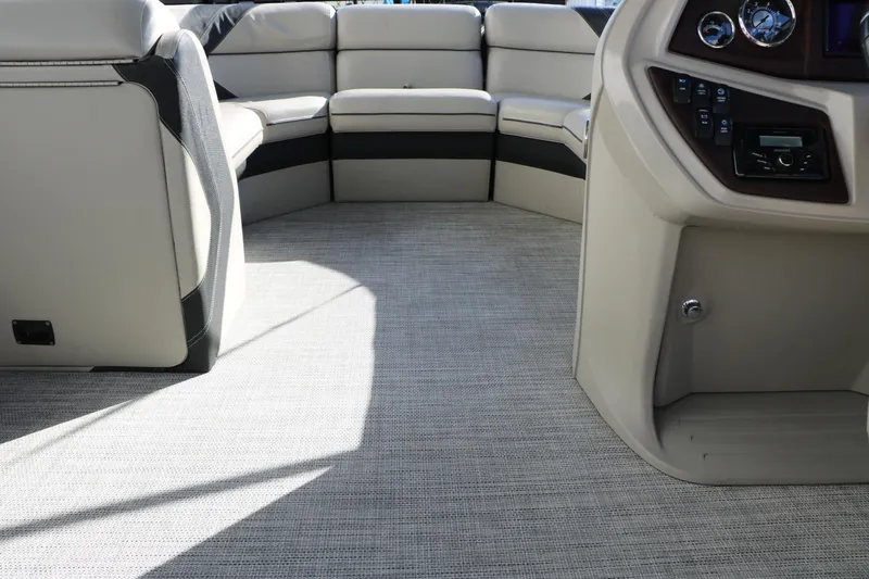 Slide: The Image of Interior of 2023 Sylvan Mirage X X3 Party Fish boat with plush seating and control panel. - 26