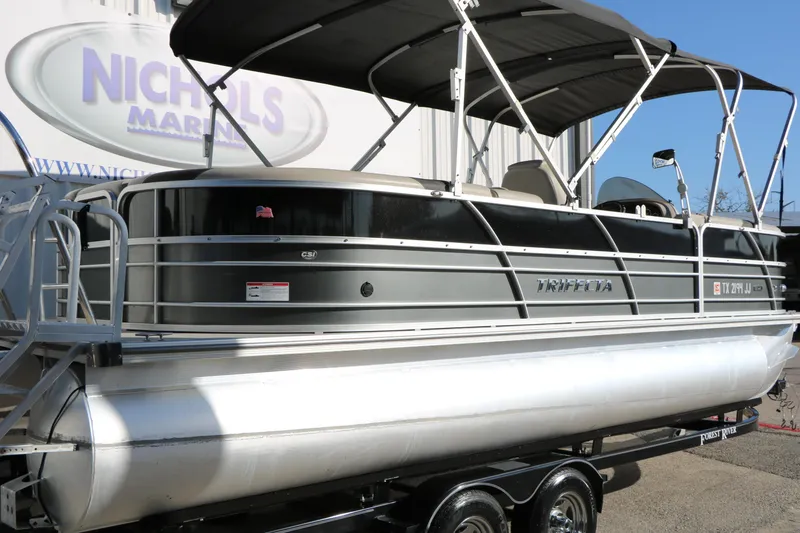 Slide: The Image of 2023 Sylvan Mirage X X3 Party Fish pontoon boat with canopy on trailer. - 3