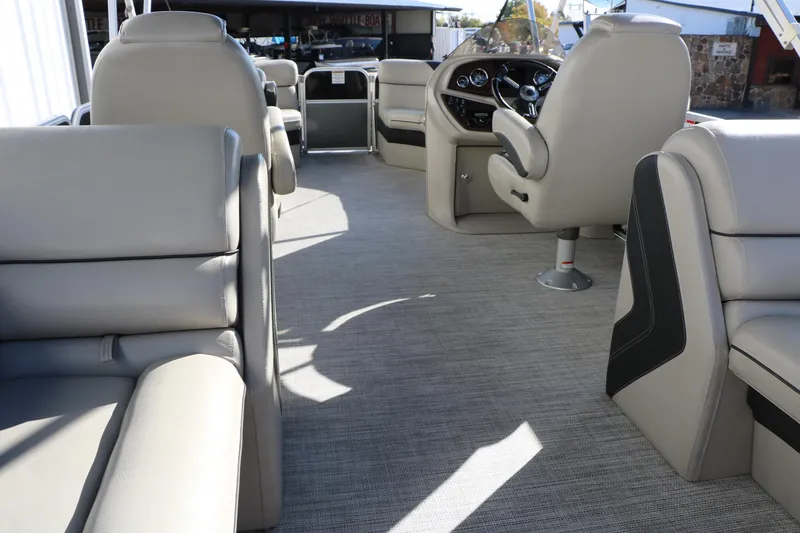 Slide: The Image of 2023 Sylvan Mirage X X3 Party Fish interior with plush seating and modern dashboard. - 30