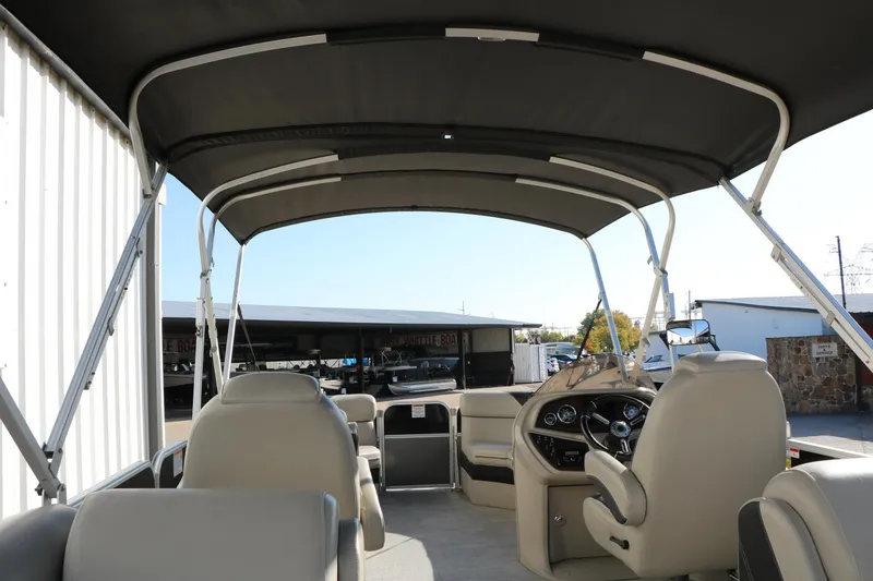 Slide: The Image of 2023 Sylvan Mirage X X3 Party Fish pontoon boat interior with canopy and seating. - 31