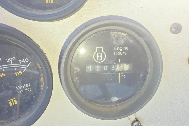 Slide: The Image of Close-up of engine hour meter showing 1203.5 hours on a 1985 Sea Ray 340 Sedan Bridge. - 16