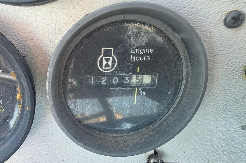 Slide: The Image of Engine hour meter showing 1203.5 hours on 1985 Sea Ray 340 Sedan Bridge. - 17
