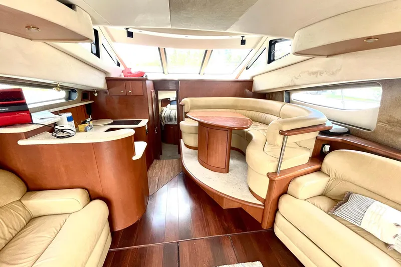 Slide: The Image of Luxurious interior of a 2005 Silverton 43 Sport Bridge yacht with elegant seating and wood finishes. - 18