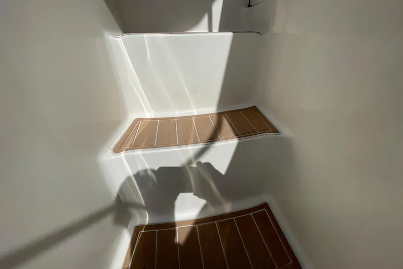 Slide: The Image of Staircase on 2005 Silverton 43 Sport Bridge yacht with wooden steps and sunlight. - 26