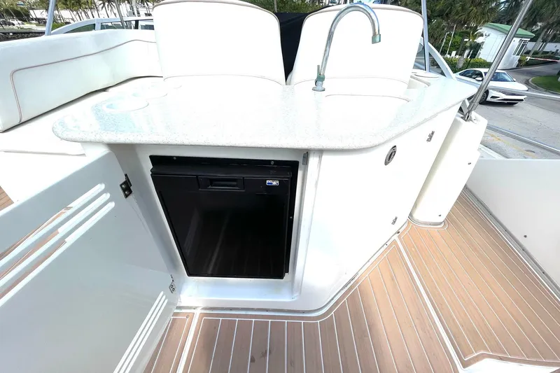 Slide: The Image of 2005 Silverton 43 Sport Bridge yacht with outdoor kitchenette and mini fridge. - 9